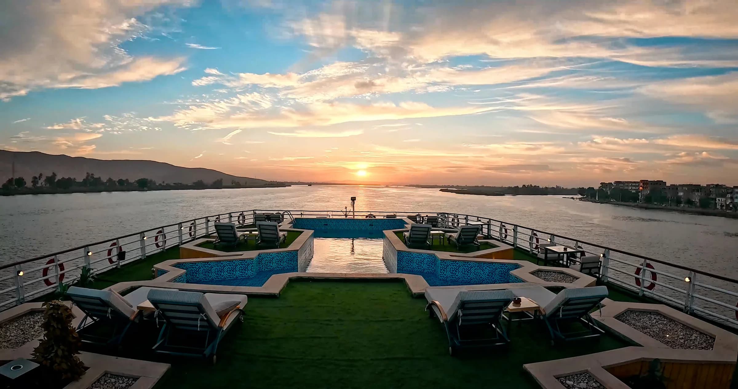 The pool deck of the M/S Alma at sunset